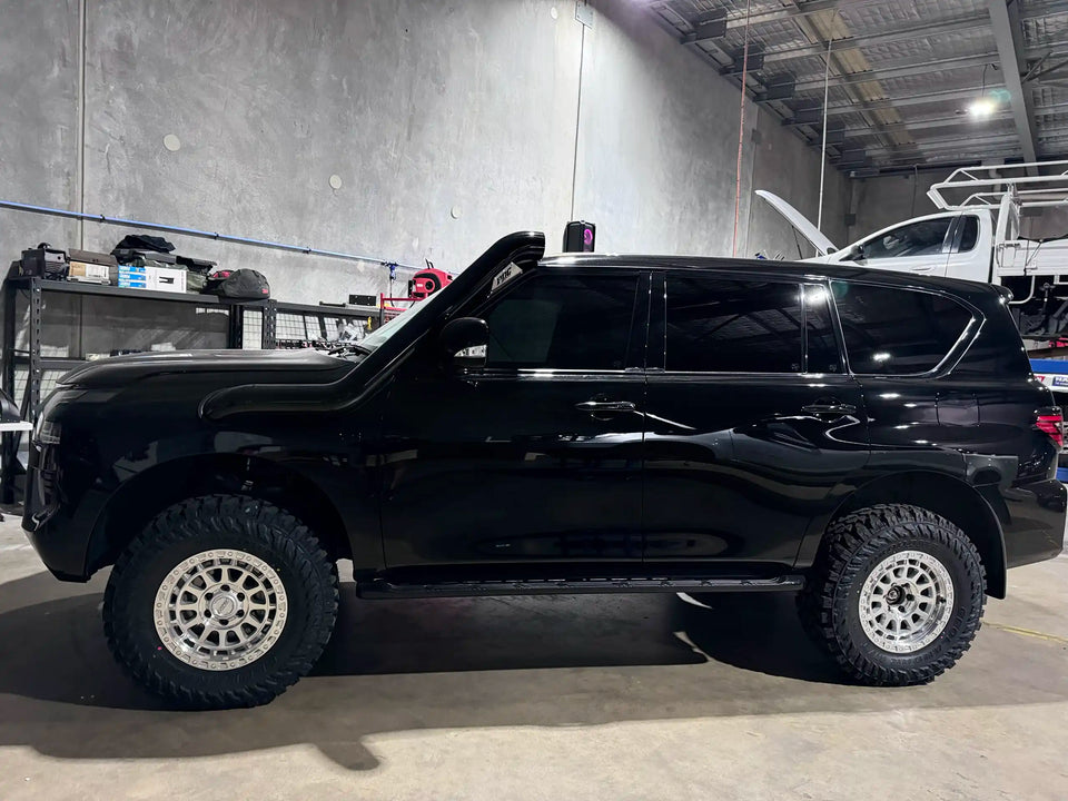 Black Nissan Patrol Y62 with lift kit and ROH Assaults