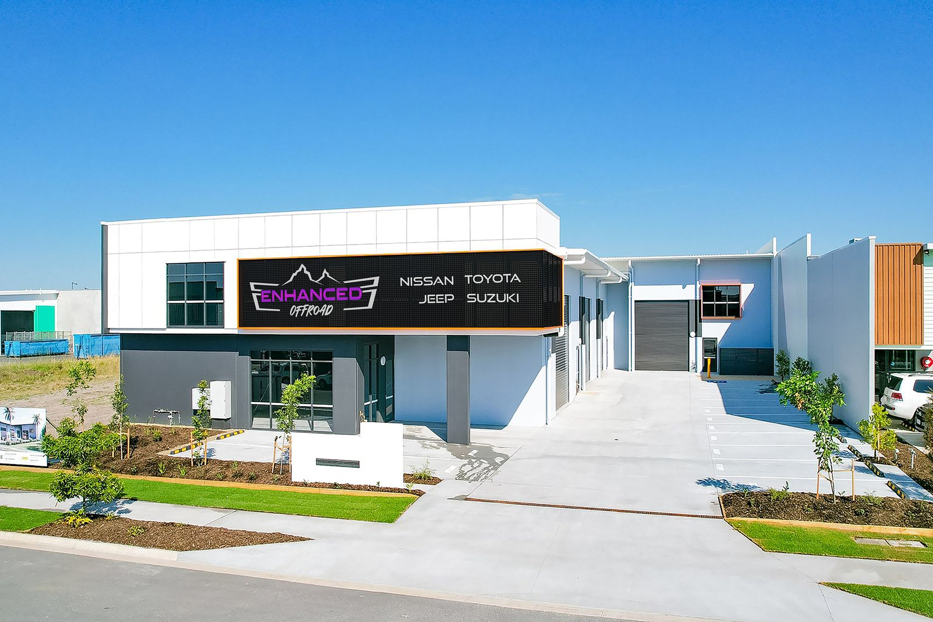 This is an image of the Enhanced Offroad building in Caloundra Brisbane QLD with the Nissan Toyota Jeep Suzuki logos.